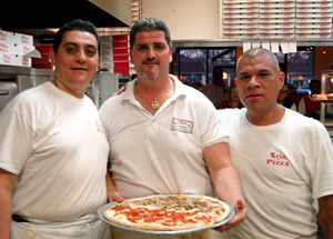 Mario Scaturro and King of Pizza employees